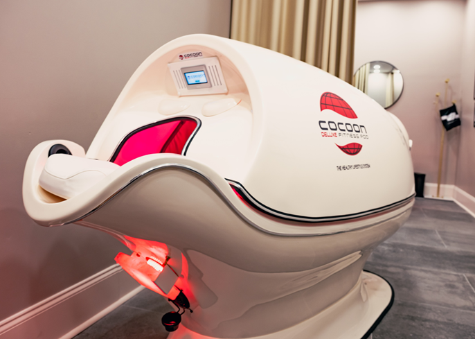 Wellness Pod at Body Lab Studio in Myrtle Beach glowing with warm, relaxing light for stress and skin relief.